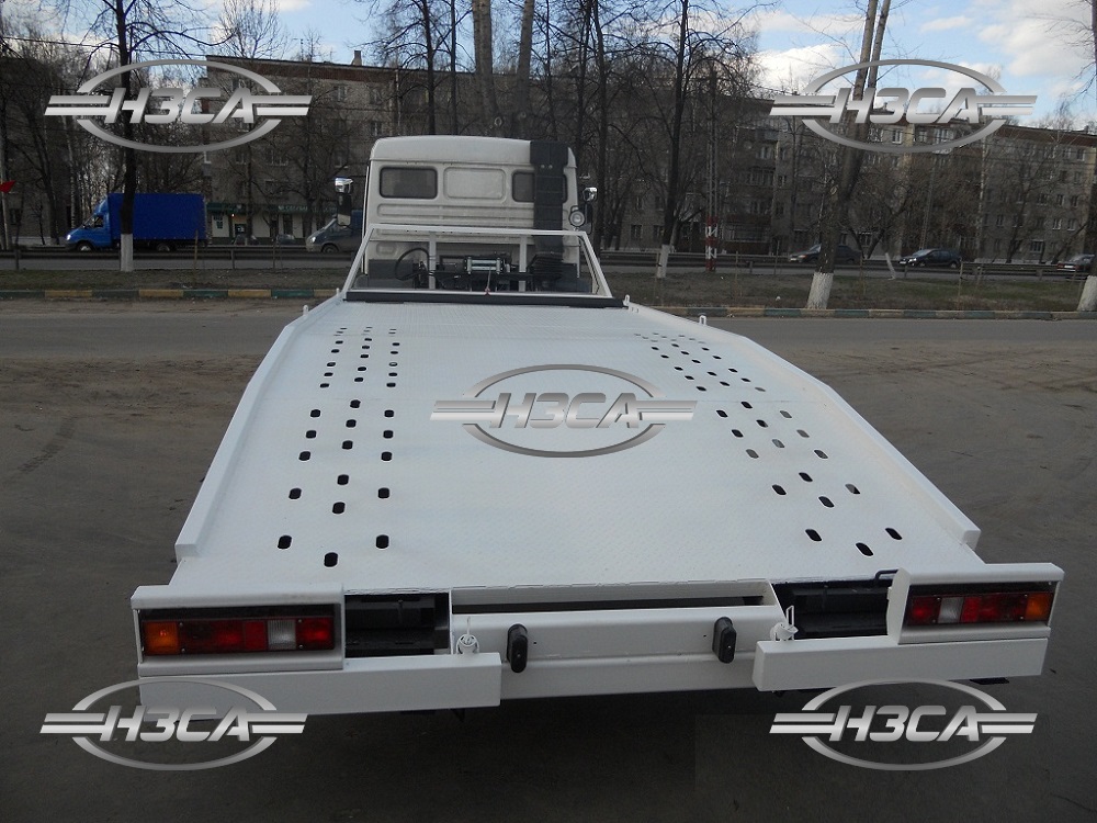 Эвакуатор КАМАЗ-4308 с ломаной платформой
