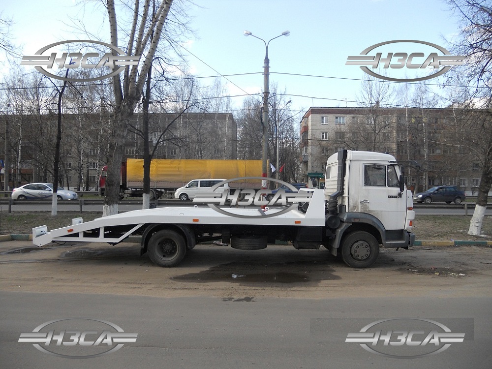Эвакуатор КАМАЗ-4308 с ломаной платформой